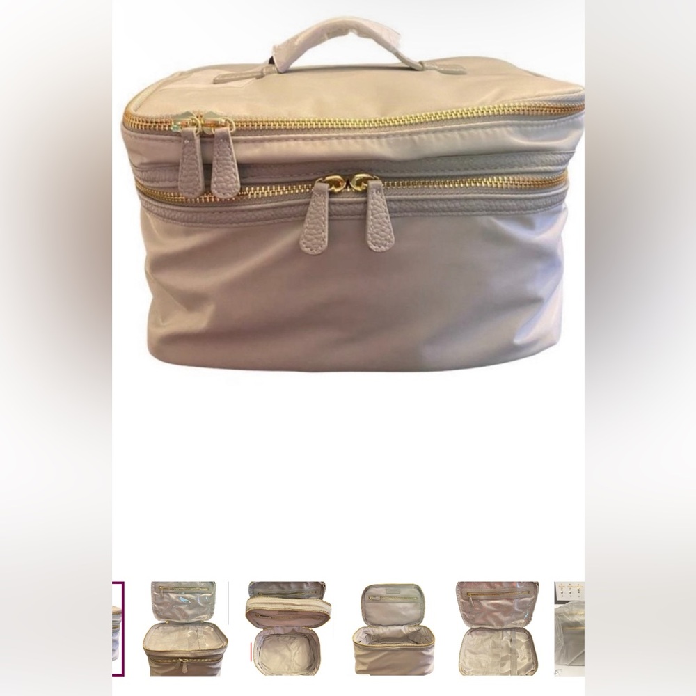 Trish McEvoy cosmetic travel bag. Light Gray/ golden zipper. Brand New in bag.